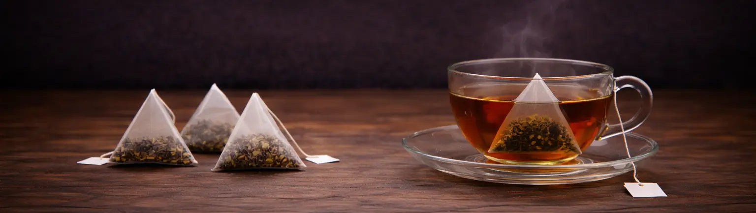Ceylon pyramid tea bag collection presented in a clean, minimalist setting that highlights quality blends and refined tea rituals