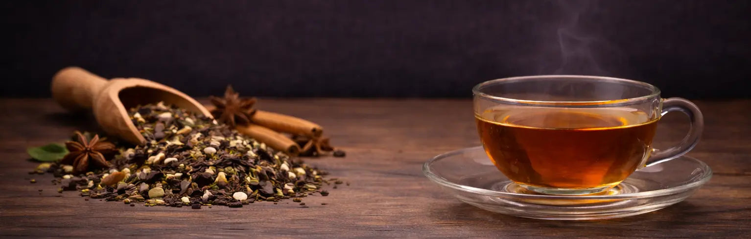Premium spiced tea collection presented in a rich, minimalist setting with warm, aromatic tones
